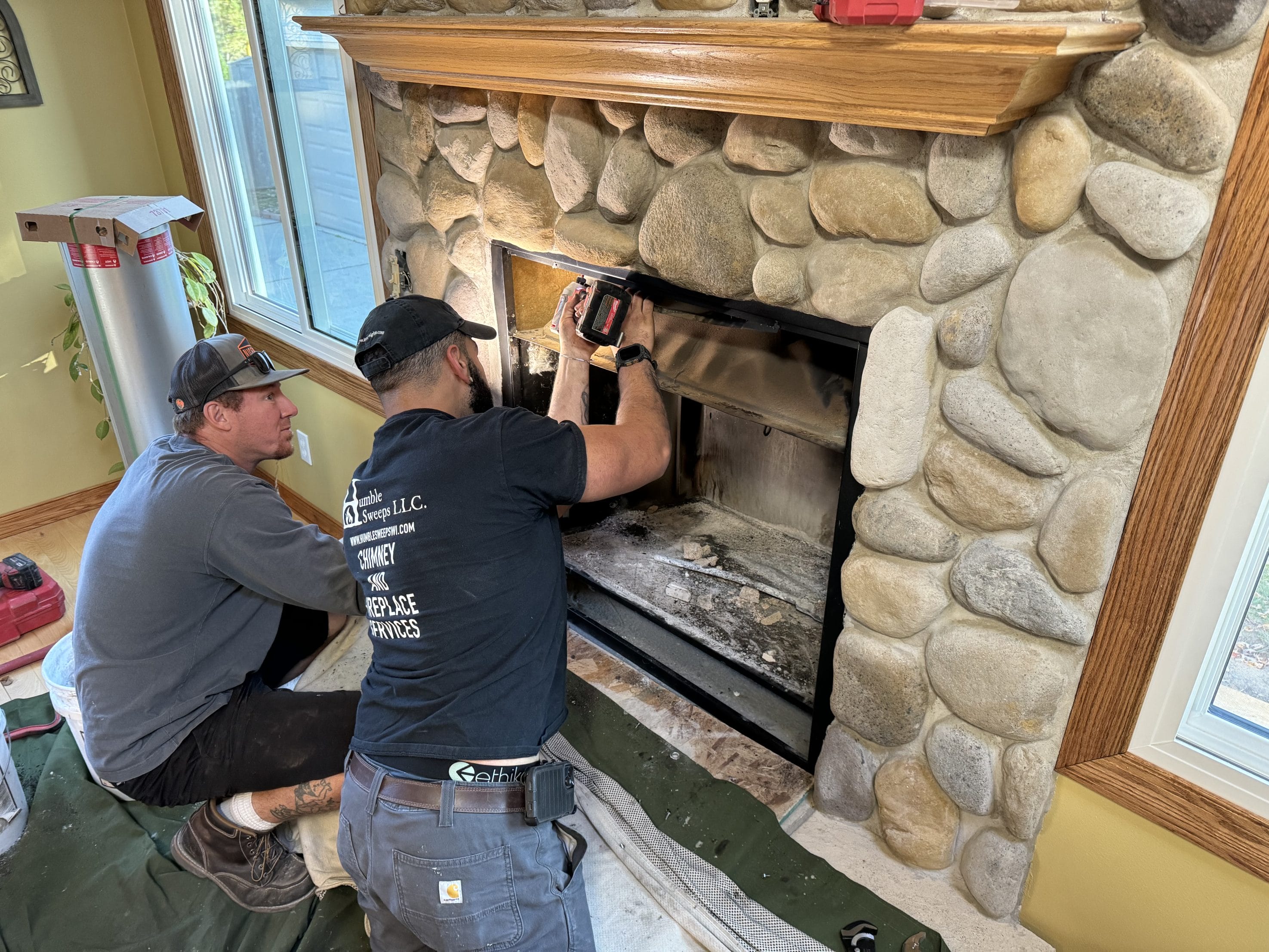 An original image of the Humble Sweeps team performing a chimney inspection.
