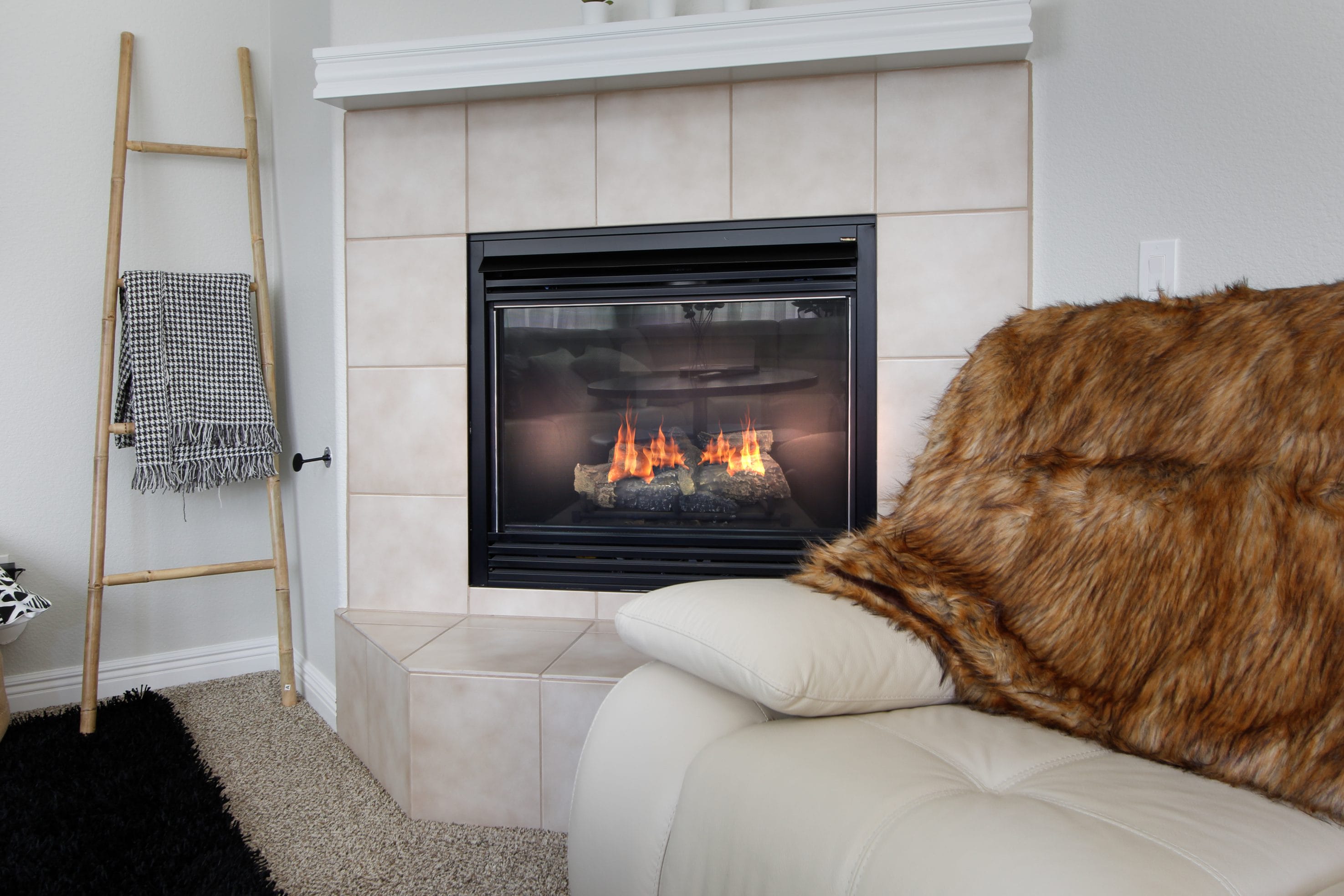 A stock image of realistic gas logs heating a living space.