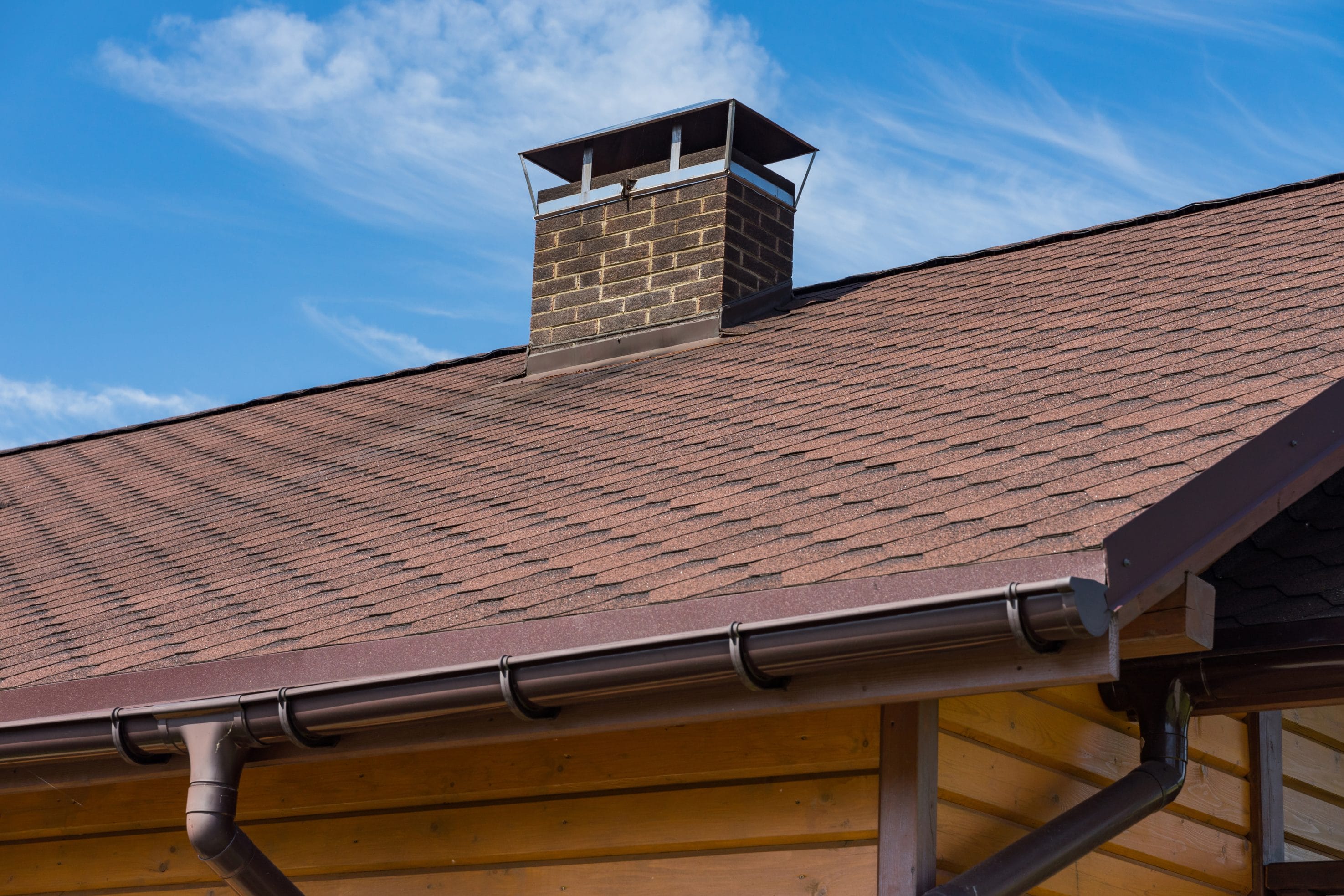 A stock image of a chimney with a quality chimney cap installed.
