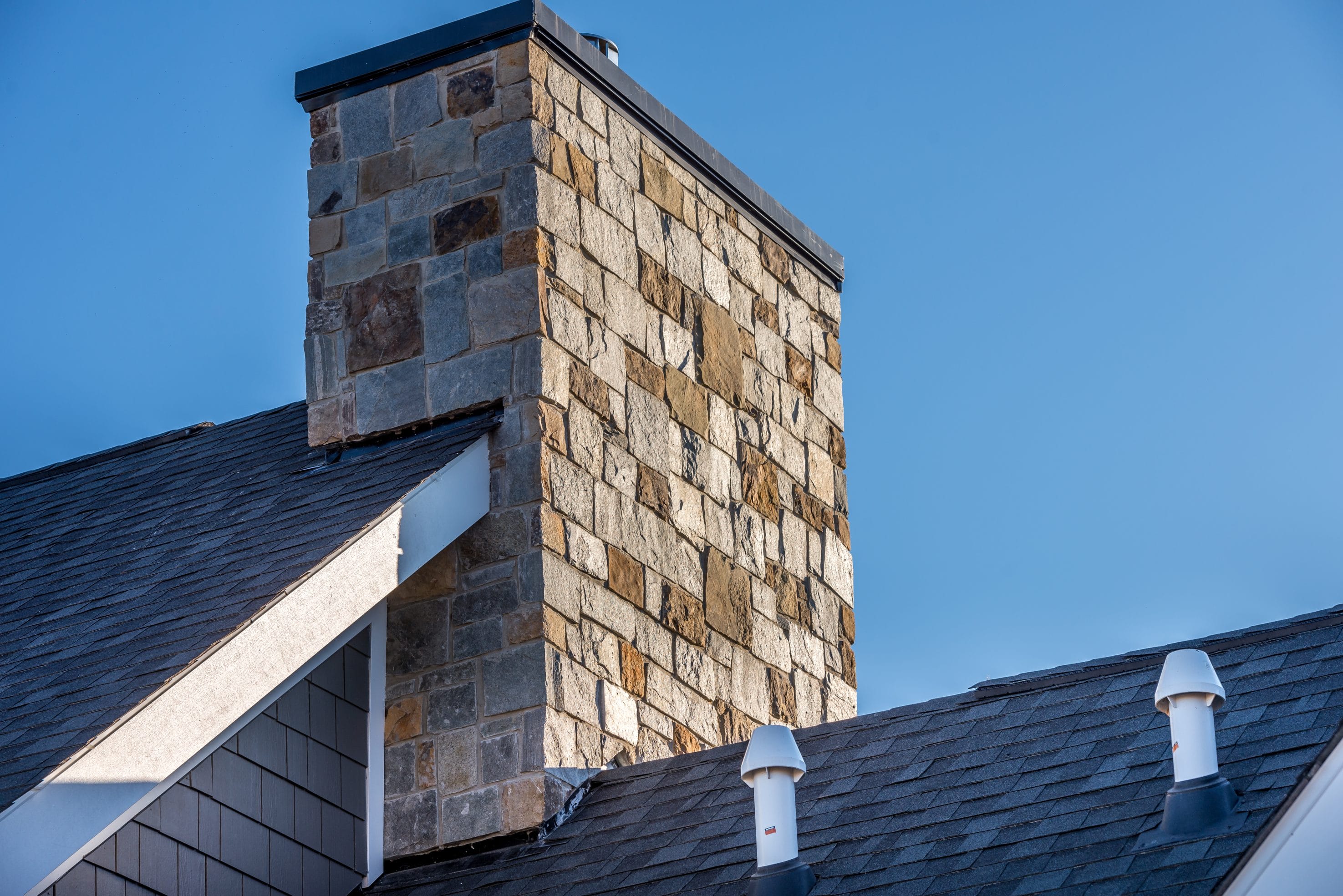 Stock image of a masonry chimney.