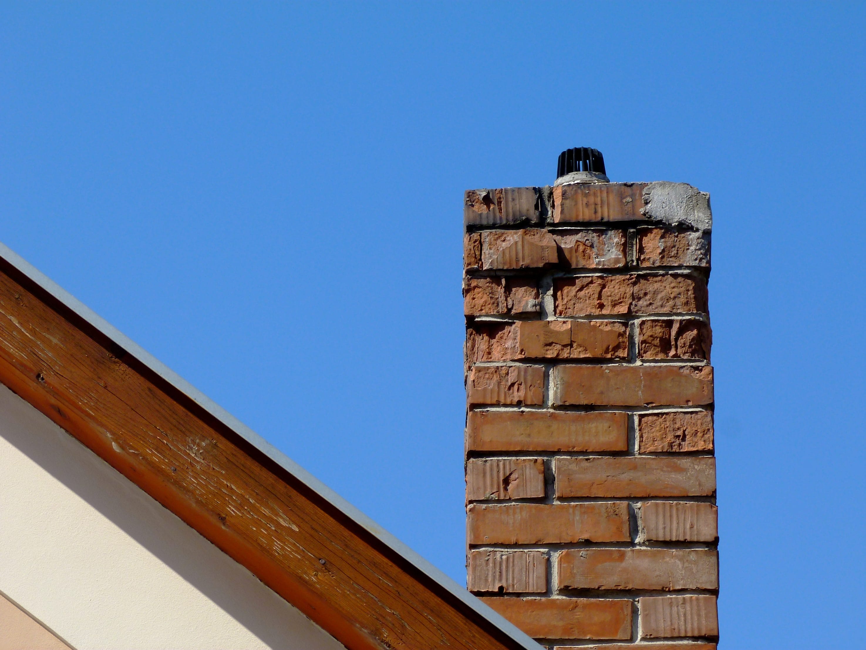 A stock image of damaged masonry chimney.