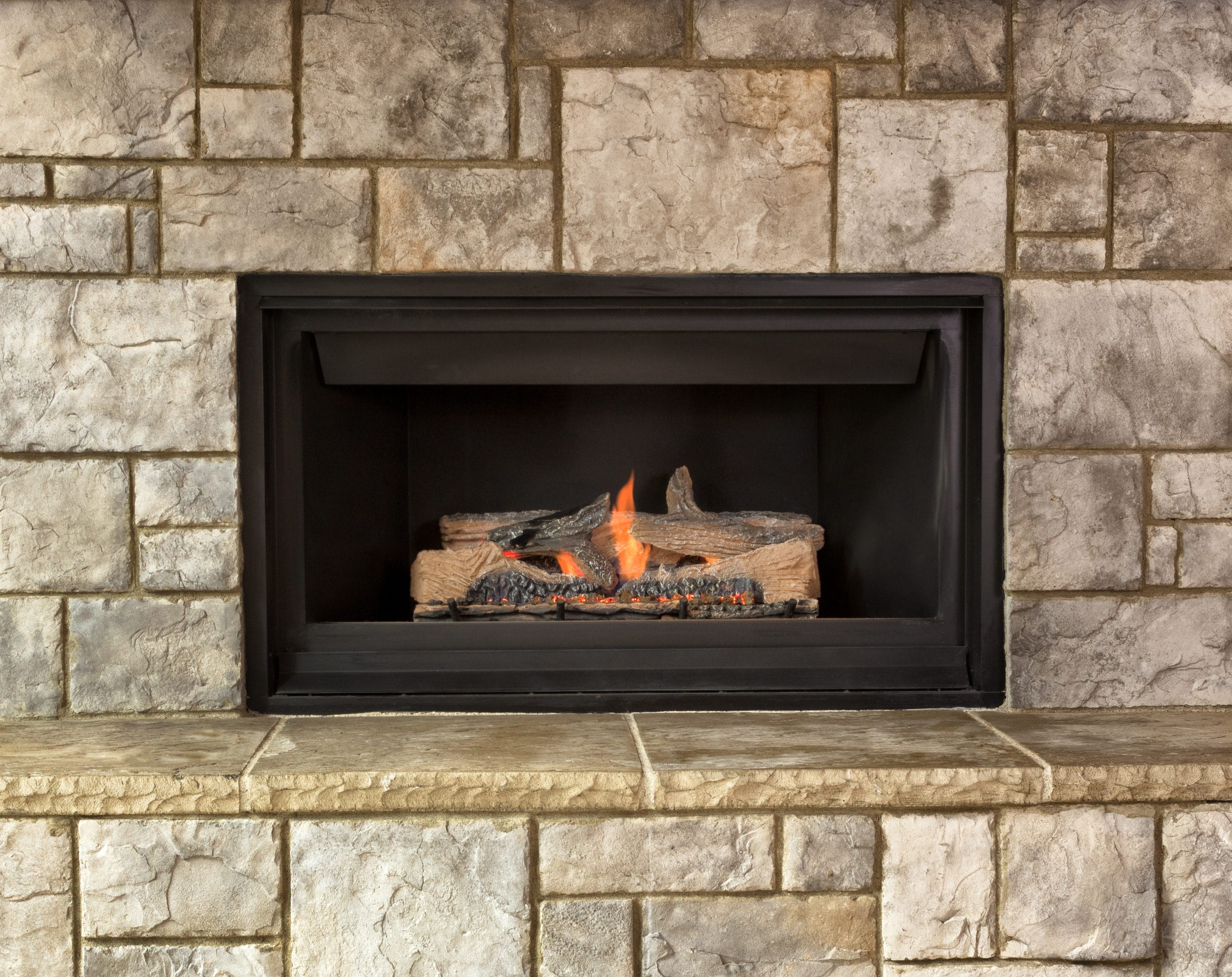A stock image of a gas fireplace in use.