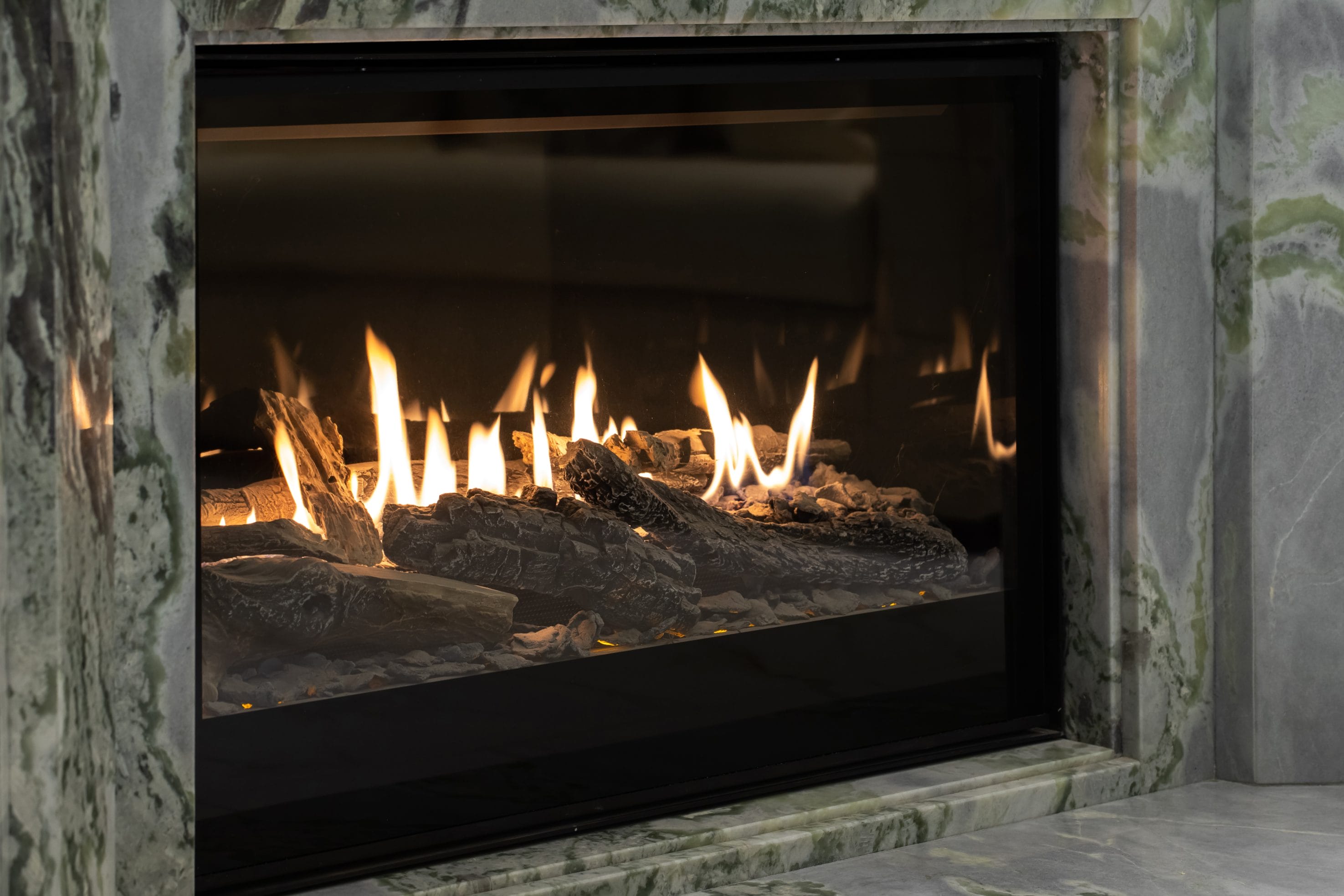 A stock image of gas fireplace insert in use.